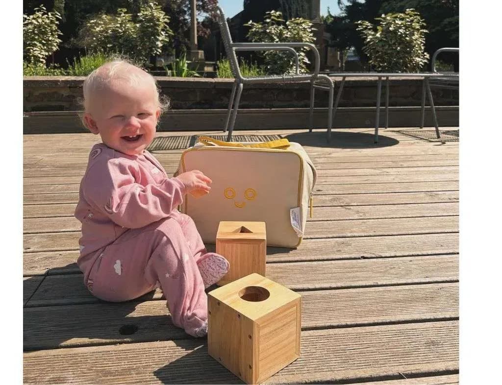 Two toddlers exploring a Boromi play mat together