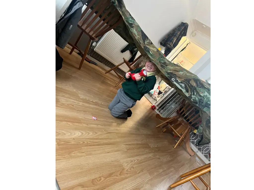A child carrying a play bag home