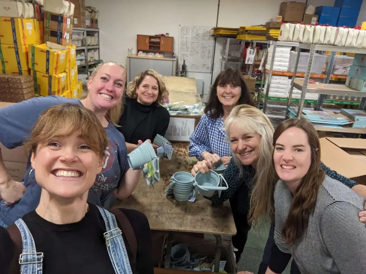 The Boromi team smiling together in the workshop